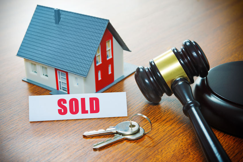 Auction gavel and sold property